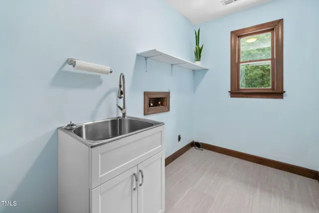 a bathroom with a double vanity sink mirror and shower
