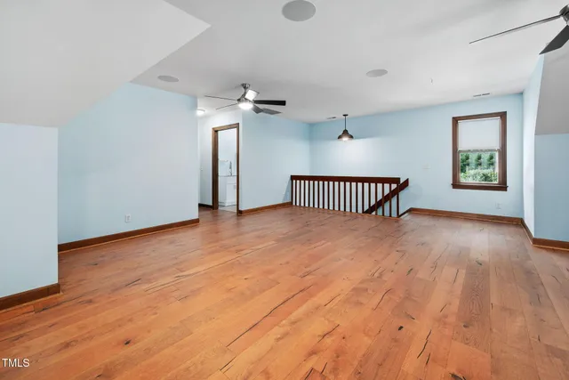 a view of a patio with table and chairs floor to ceiling window with wooden floor