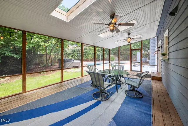 a view of a house with dining area and seating area
