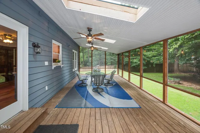 a view of a house with swimming pool and porch