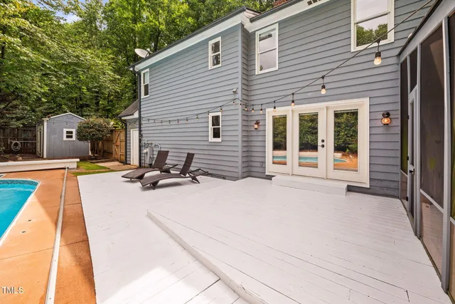 a view of a swimming pool with a yard