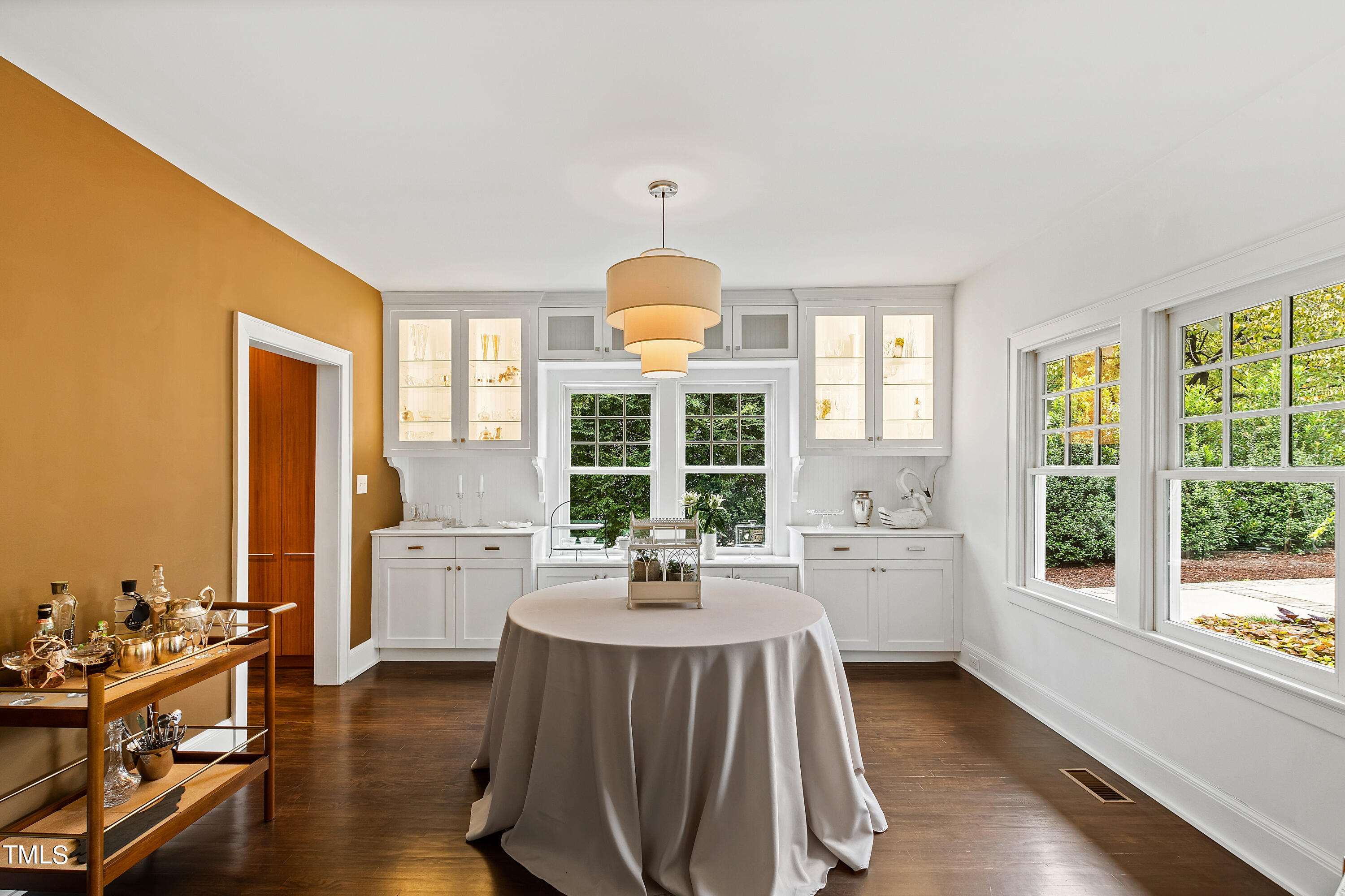 2212 The Circle Raleigh, NC 27608 - Photo 14 of 88 a kitchen with sink refrigerator dining table and chairs