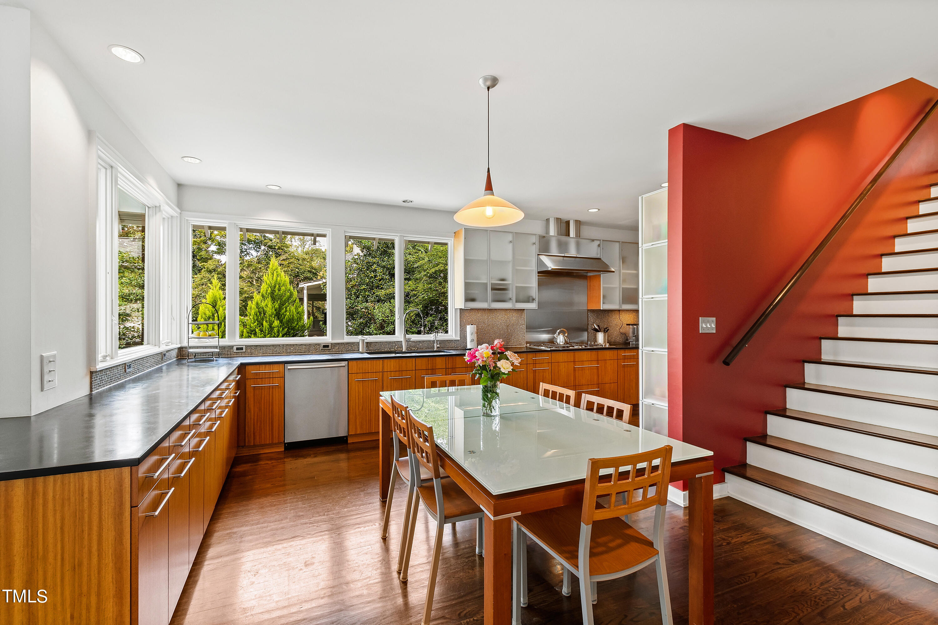 2212 The Circle Raleigh, NC 27608 - Photo 27 of 88 a view of a dining room with furniture window and wooden floor