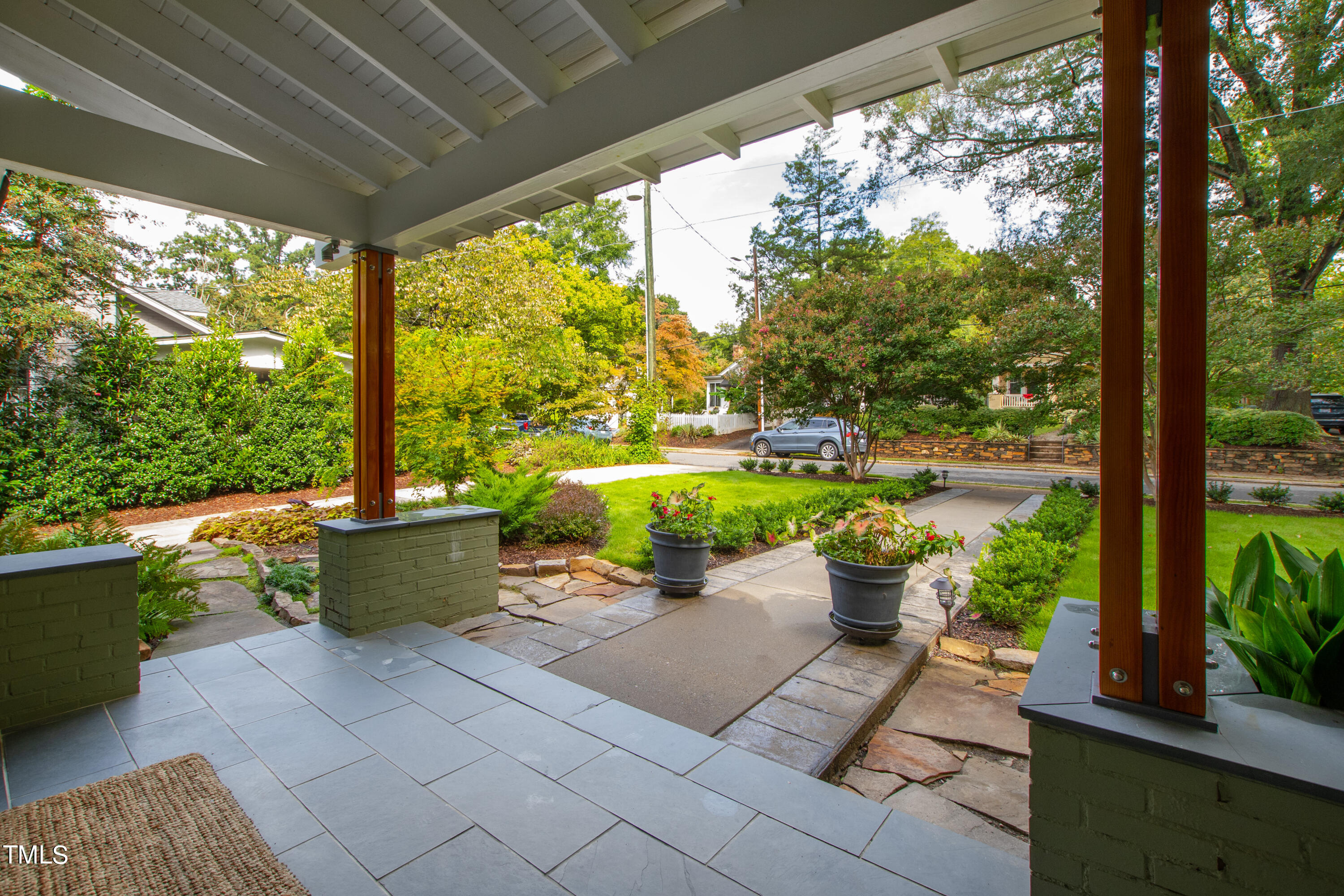 2212 The Circle Raleigh, NC 27608 - Photo 3 of 88 a view of a patio with couches plants and a patio