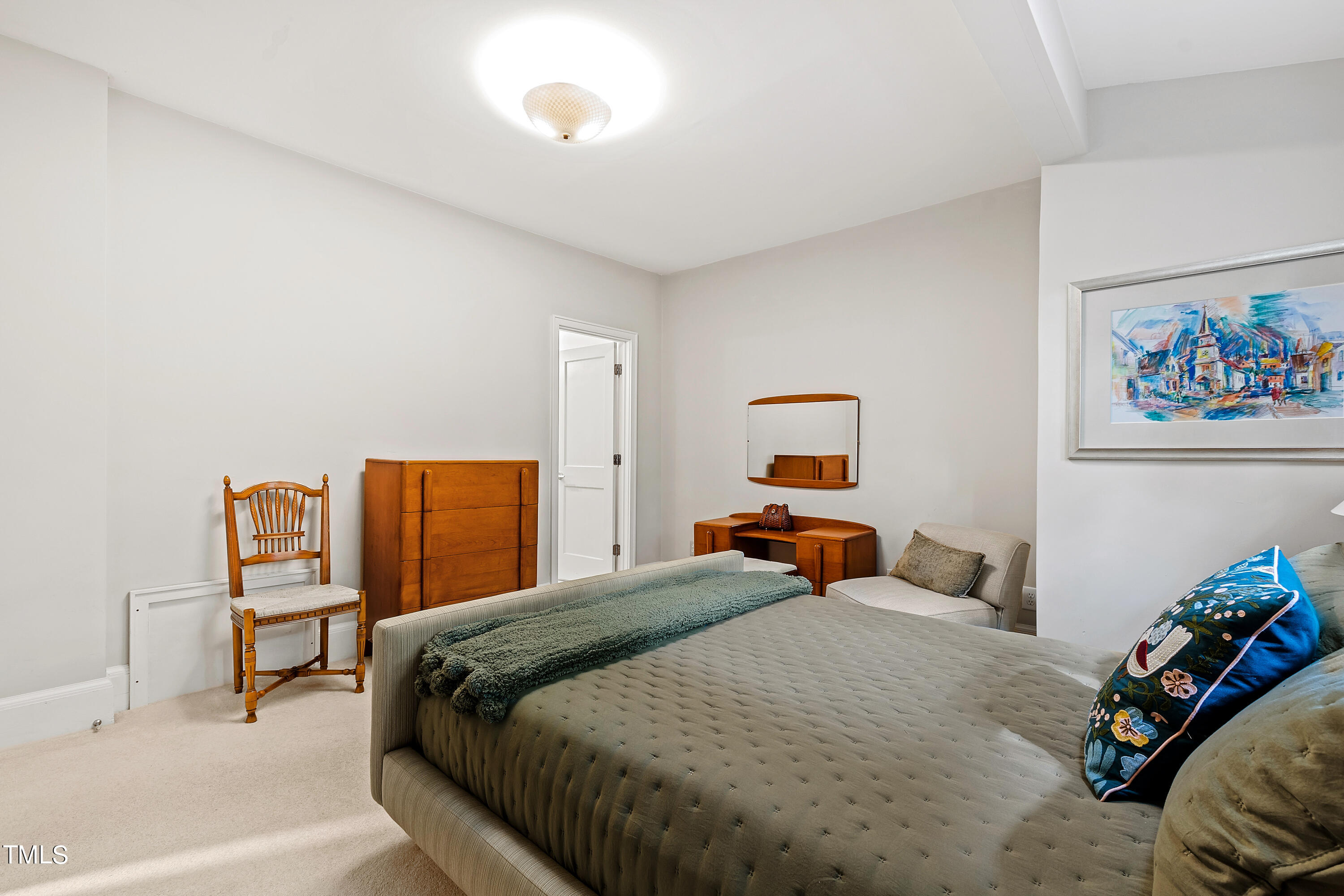 2212 The Circle Raleigh, NC 27608 - Photo 44 of 88 a bedroom with a bed and a lamp on dresser