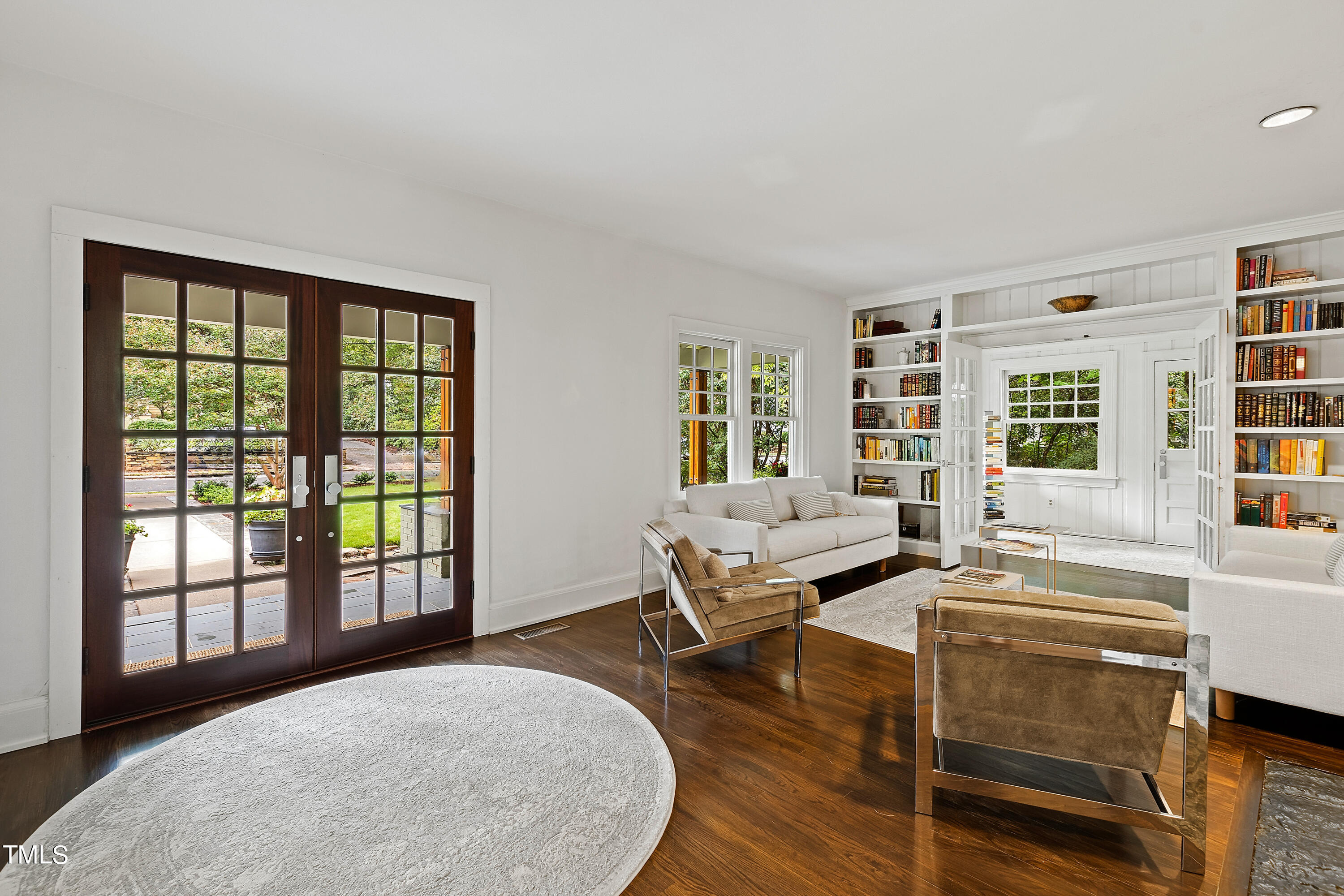 2212 The Circle Raleigh, NC 27608 - Photo 5 of 88 a living room with furniture and large windows