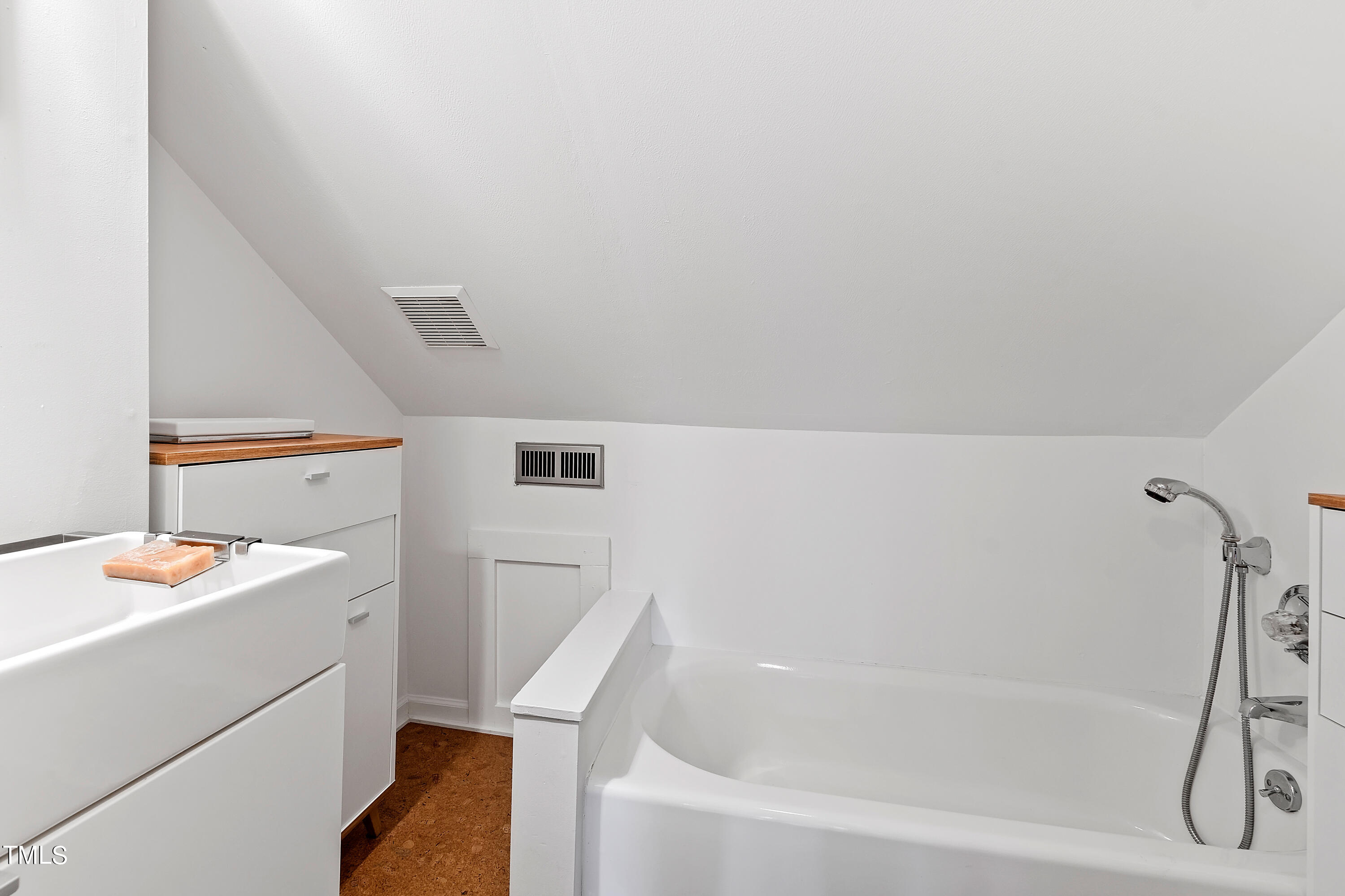 2212 The Circle Raleigh, NC 27608 - Photo 52 of 88 a bathroom with a bathtub sink and toilet