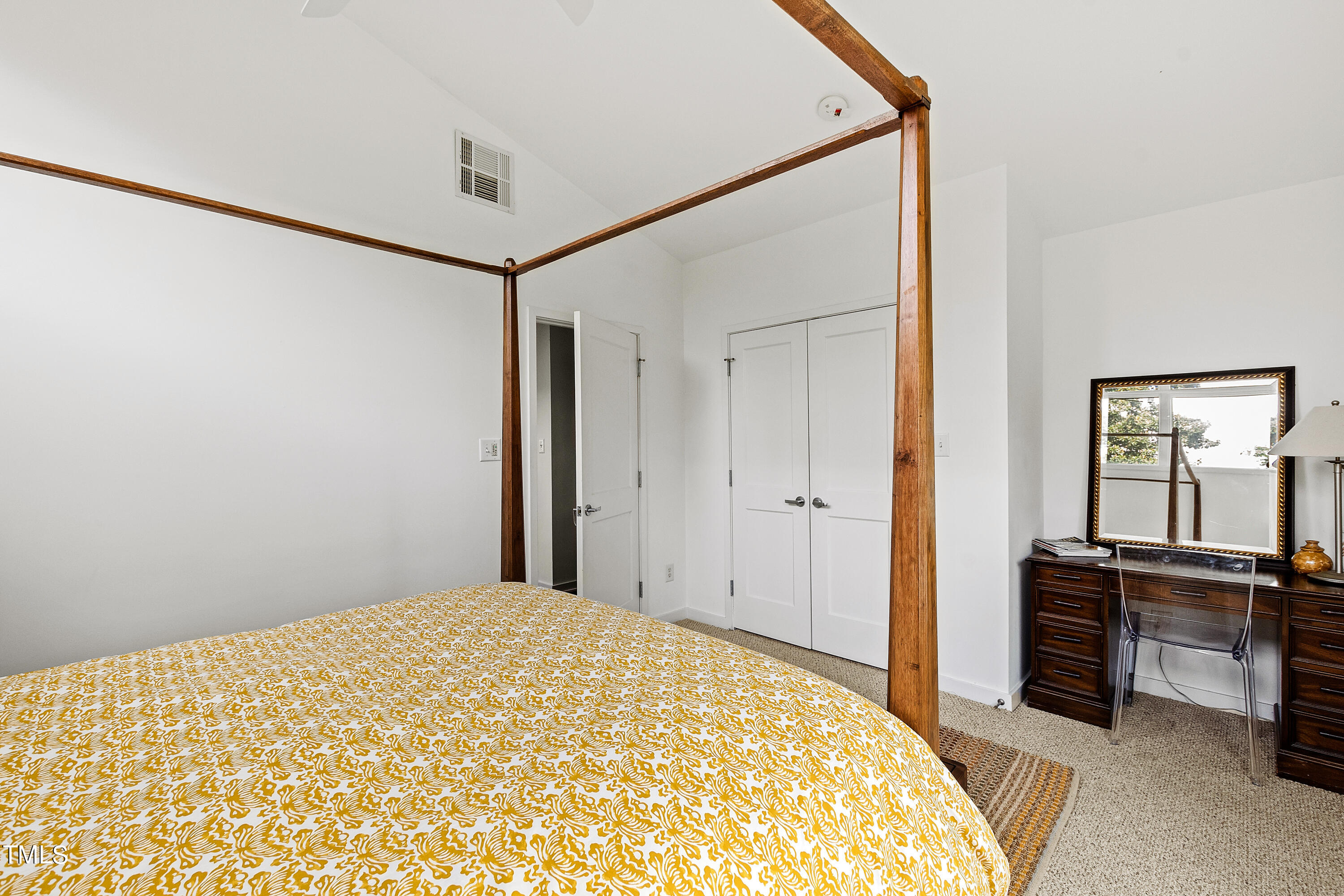 2212 The Circle Raleigh, NC 27608 - Photo 79 of 88 a bedroom with a bed and a dresser