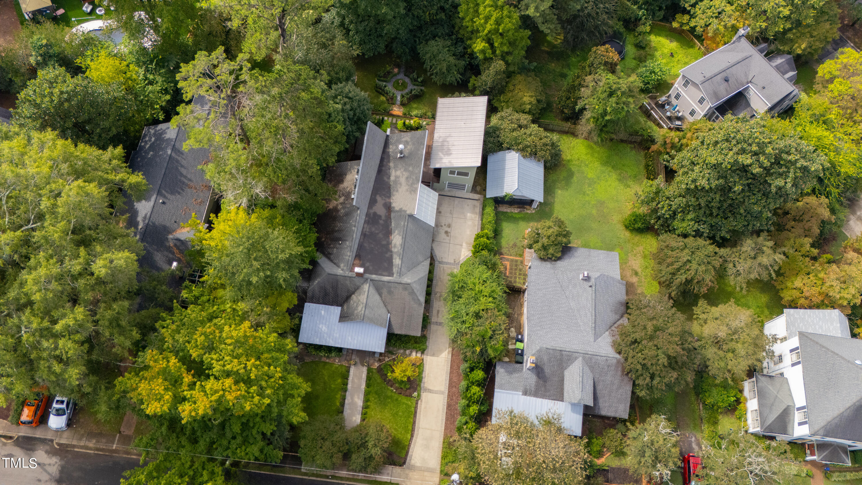 2212 The Circle Raleigh, NC 27608 - Photo 84 of 88 an aerial view of house with yard swimming pool and outdoor seating
