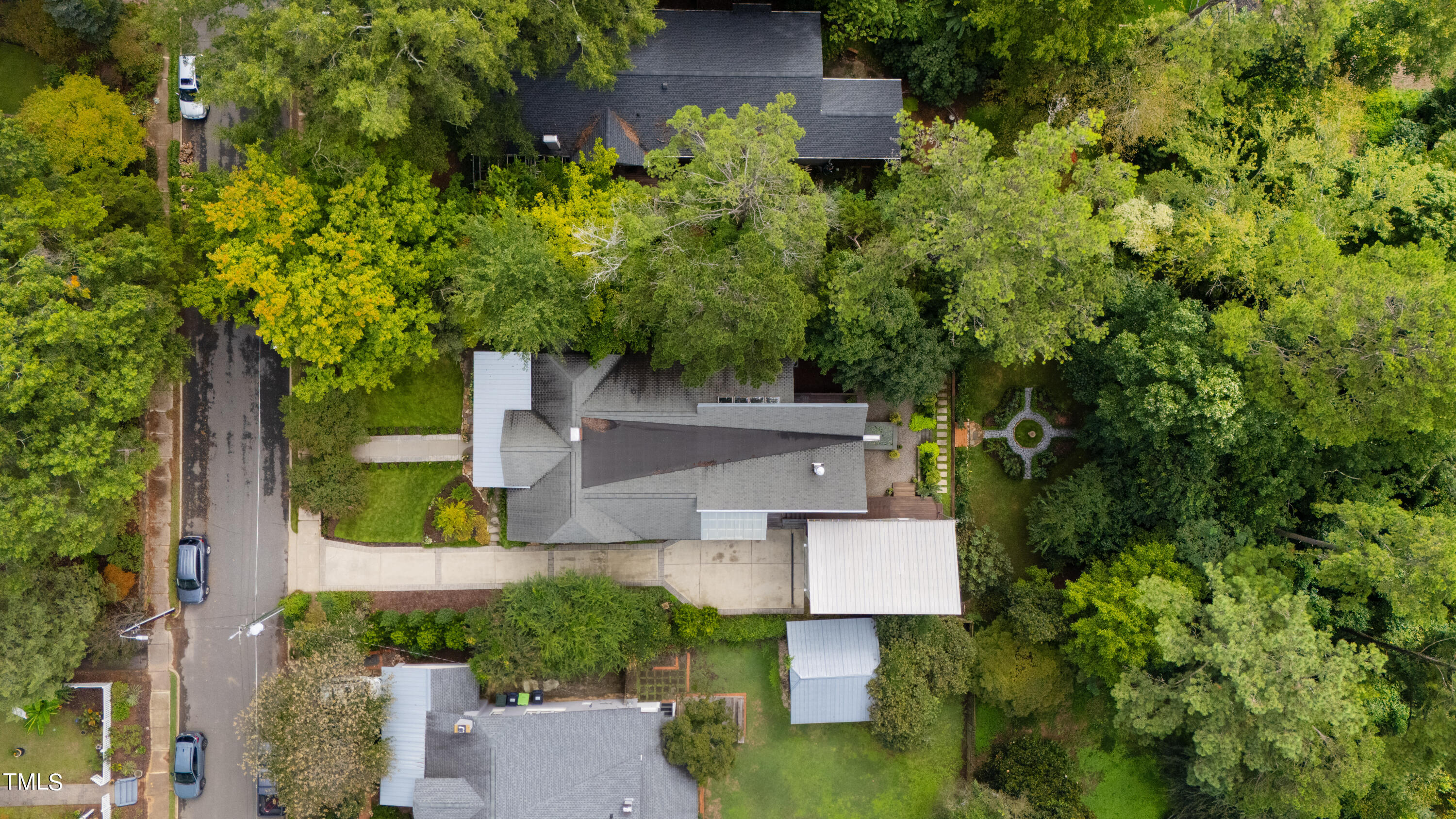 2212 The Circle Raleigh, NC 27608 - Photo 85 of 88 an aerial view of a house with a yard swimming pool and outdoor seating