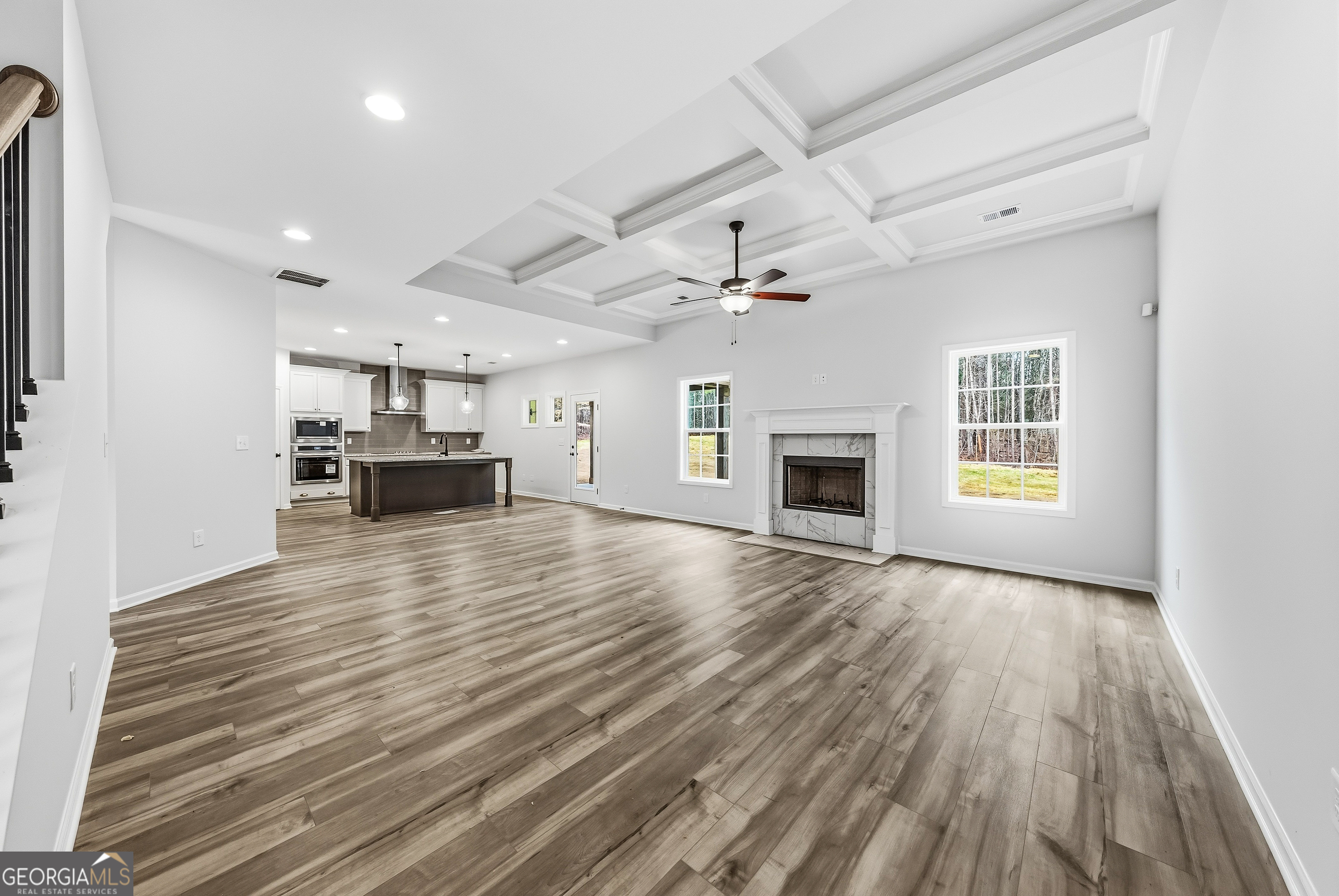 75 Oak Ridge Drive, Unit 4 Pine Mountain, GA 31822 - Photo 10 of 41 an empty room with wooden floor a fireplace and windows