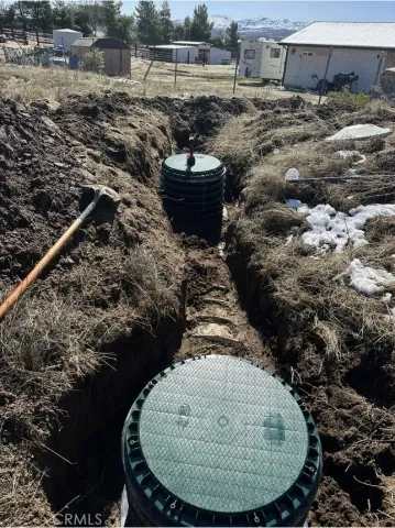 a view of a swimming pool with a yard