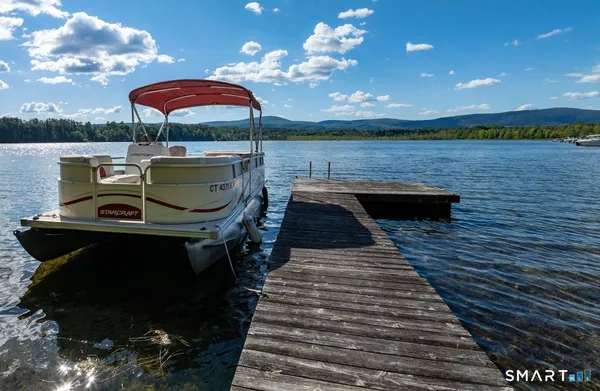 a view of a patio with wooden floor