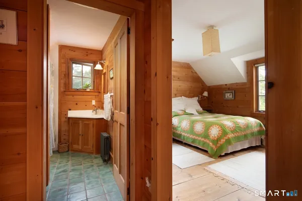 a bedroom with a bed and a couch