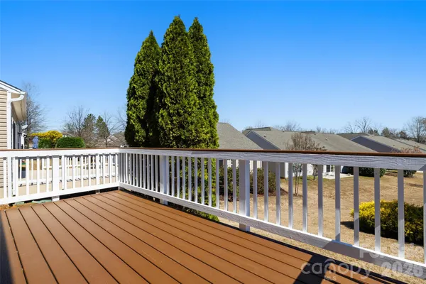 a view of house with a yard and sitting space