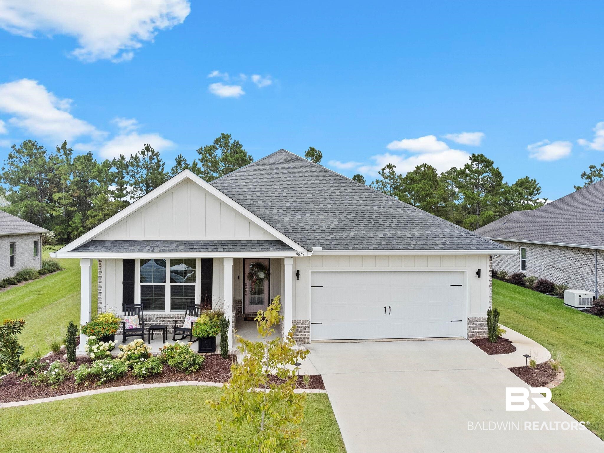9815 Lakeview Drive Foley, AL 36535 - Photo 1 of 100 Craftsman-style home with a front yard, central AC unit, and a garage