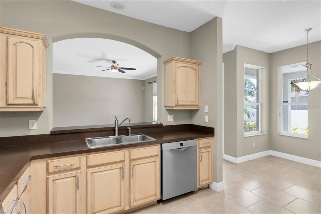 10121 Porch Street New Port Richey, FL 34655 - Photo 11 of 57 a kitchen with granite countertop a sink and cabinets