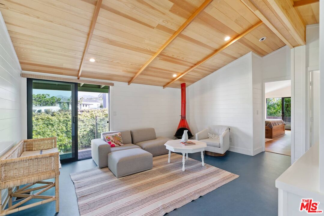 249 Paradise Cove Road Malibu, CA 90265 - Photo 14 of 41 a living room with furniture and a window