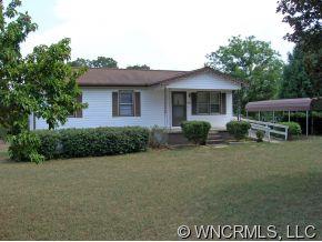 394 Whiteside Road Rutherfordton, NC 28139 - Photo 1 of 12 a front view of a house with garden