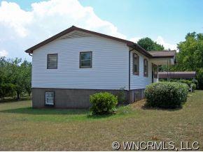 394 Whiteside Road Rutherfordton, NC 28139 - Photo 3 of 12 a front view of a house with a yard