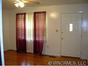 394 Whiteside Road Rutherfordton, NC 28139 - Photo 4 of 12 an empty room with windows