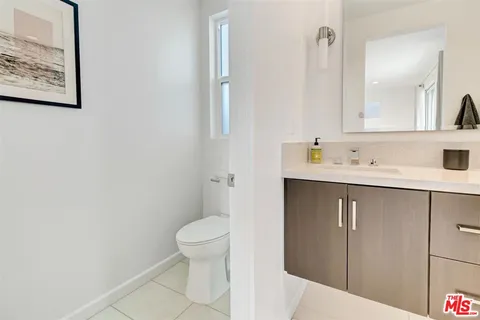 a bathroom with a sink toilet and vanity