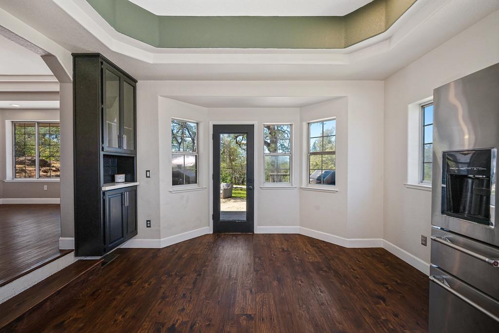 3154 Twin K Road Pilot Hill, CA 95664 - Photo 39 of 89 an empty room with wooden floor and windows