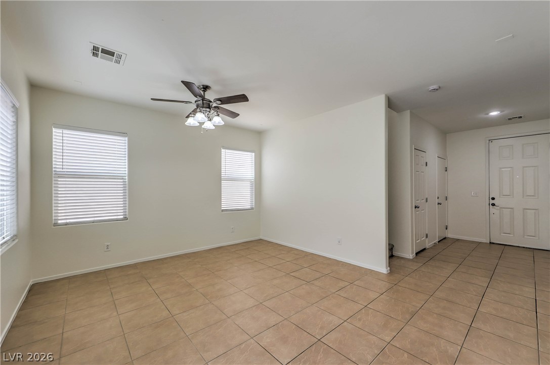 10939 Paradise Road Henderson, NV 89052 - Photo 16 of 36 Functional open living area with cool tile flooring and plentiful natural light.