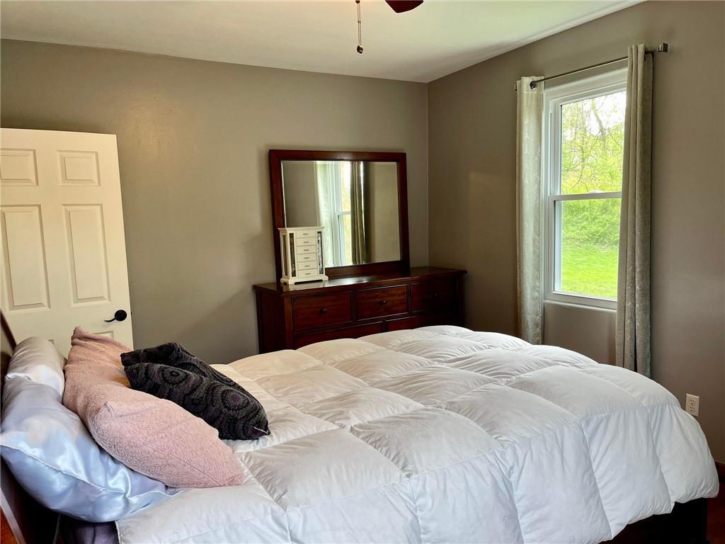 700 Ottillia Street Pittsburgh, PA 15210 - Photo 12 of 20 a bedroom with a bed and window