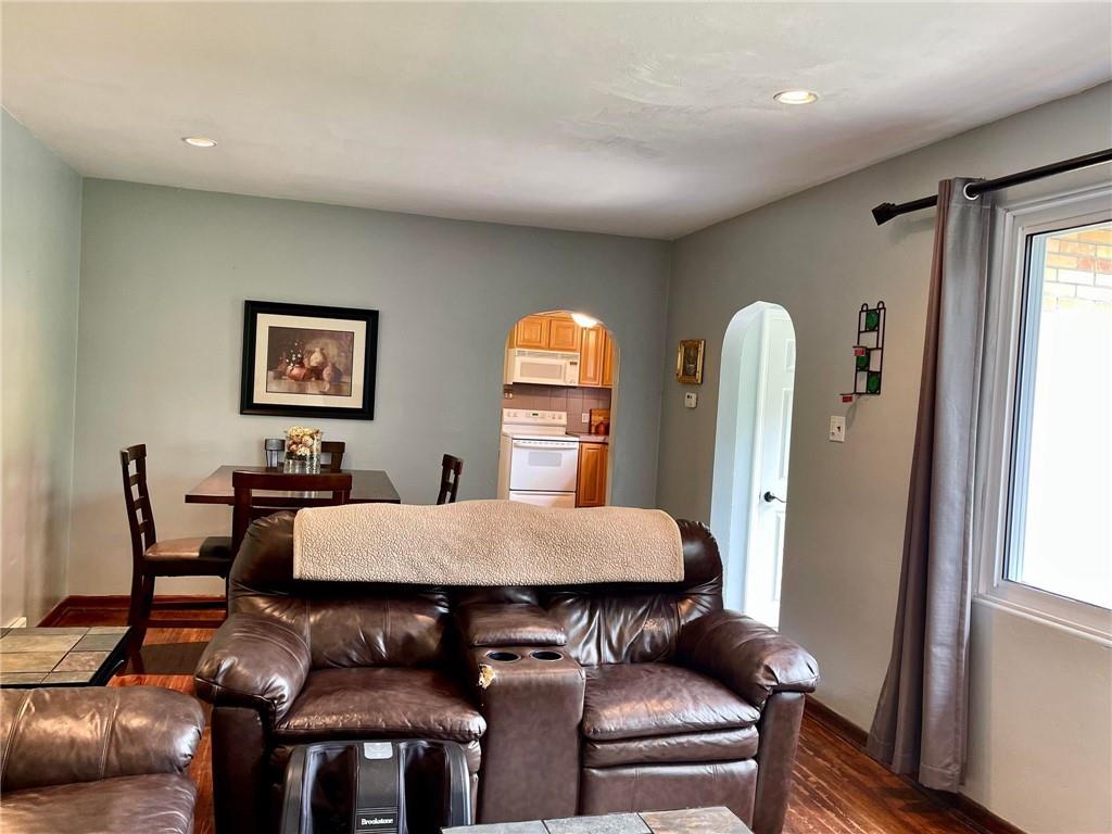 700 Ottillia Street Pittsburgh, PA 15210 - Photo 2 of 20 a view of a dining room with furniture and wooden floor