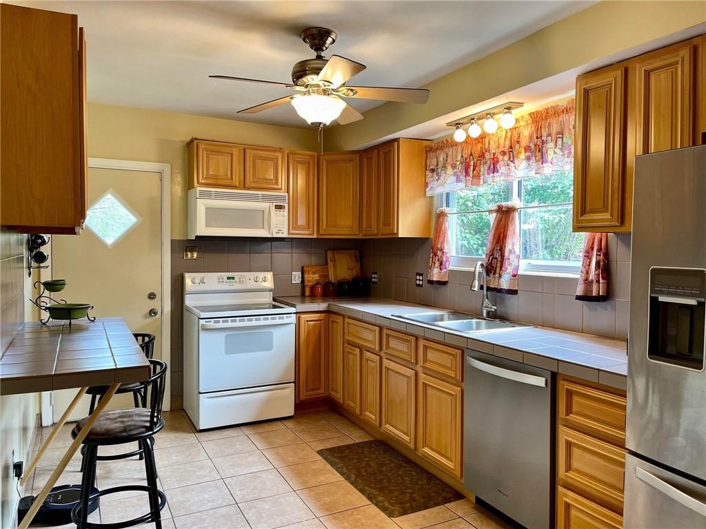 700 Ottillia Street Pittsburgh, PA 15210 - Photo 5 of 20 a kitchen with a sink cabinets and window