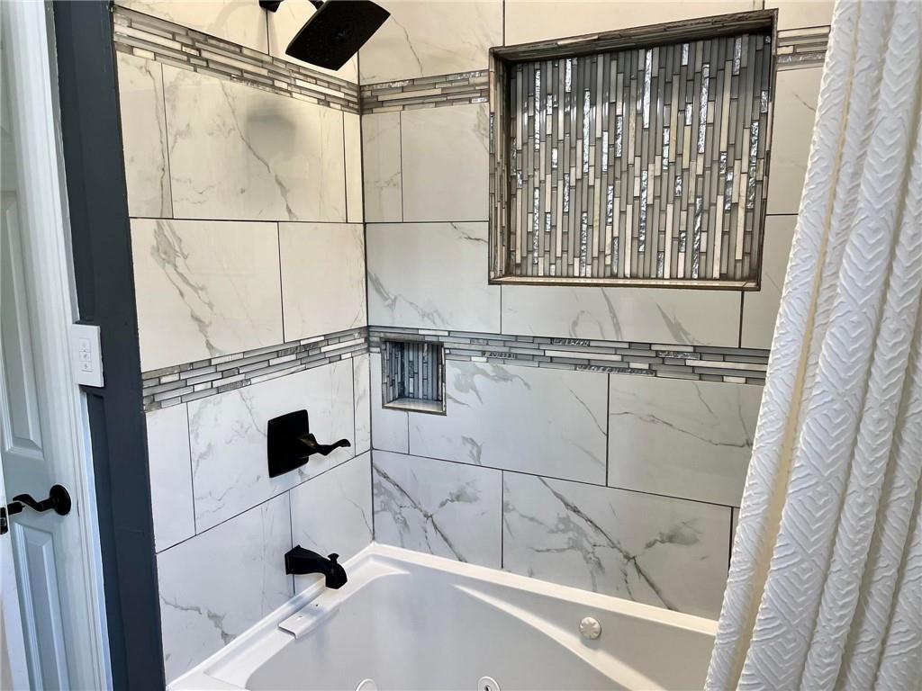 700 Ottillia Street Pittsburgh, PA 15210 - Photo 9 of 20 a bathroom with a bathtub and shower