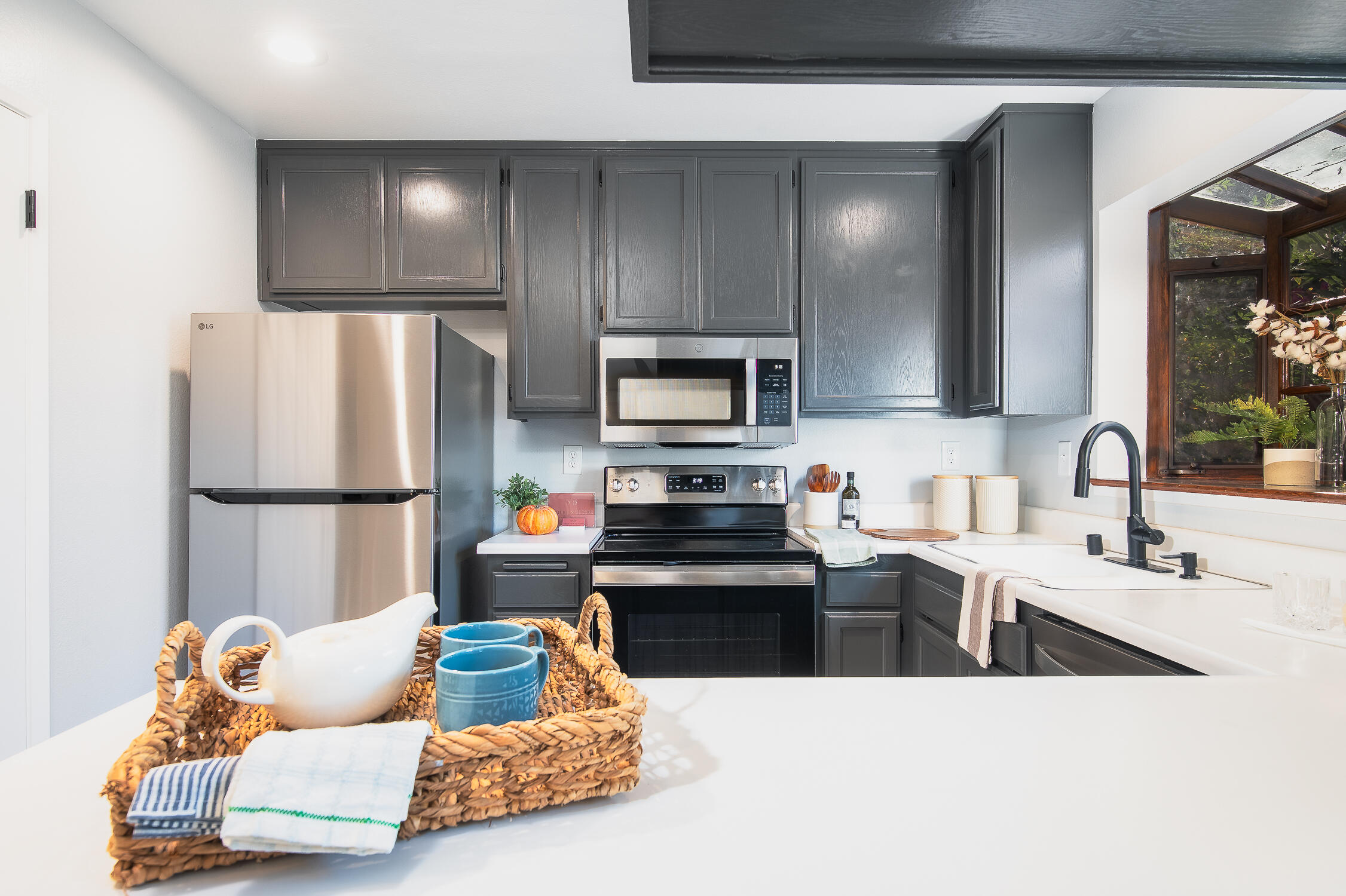 4344 Modoc Road, Unit 2 Santa Barbara, CA 93110 - Photo 12 of 28 a living room with kitchen island furniture and a kitchen view
