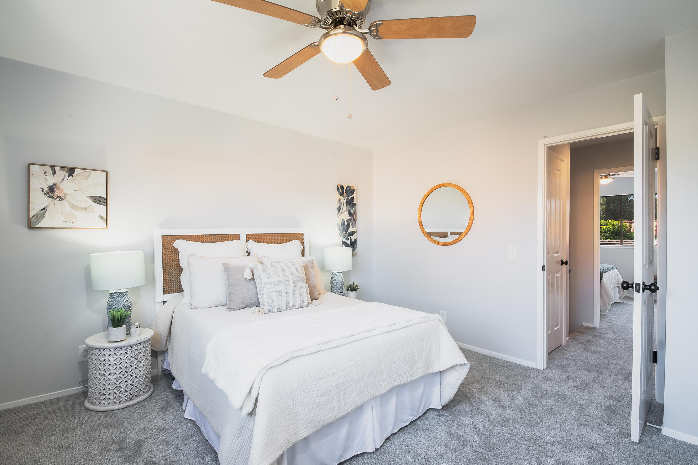 4344 Modoc Road, Unit 2 Santa Barbara, CA 93110 - Photo 16 of 28 a bedroom with a bed and a chandelier