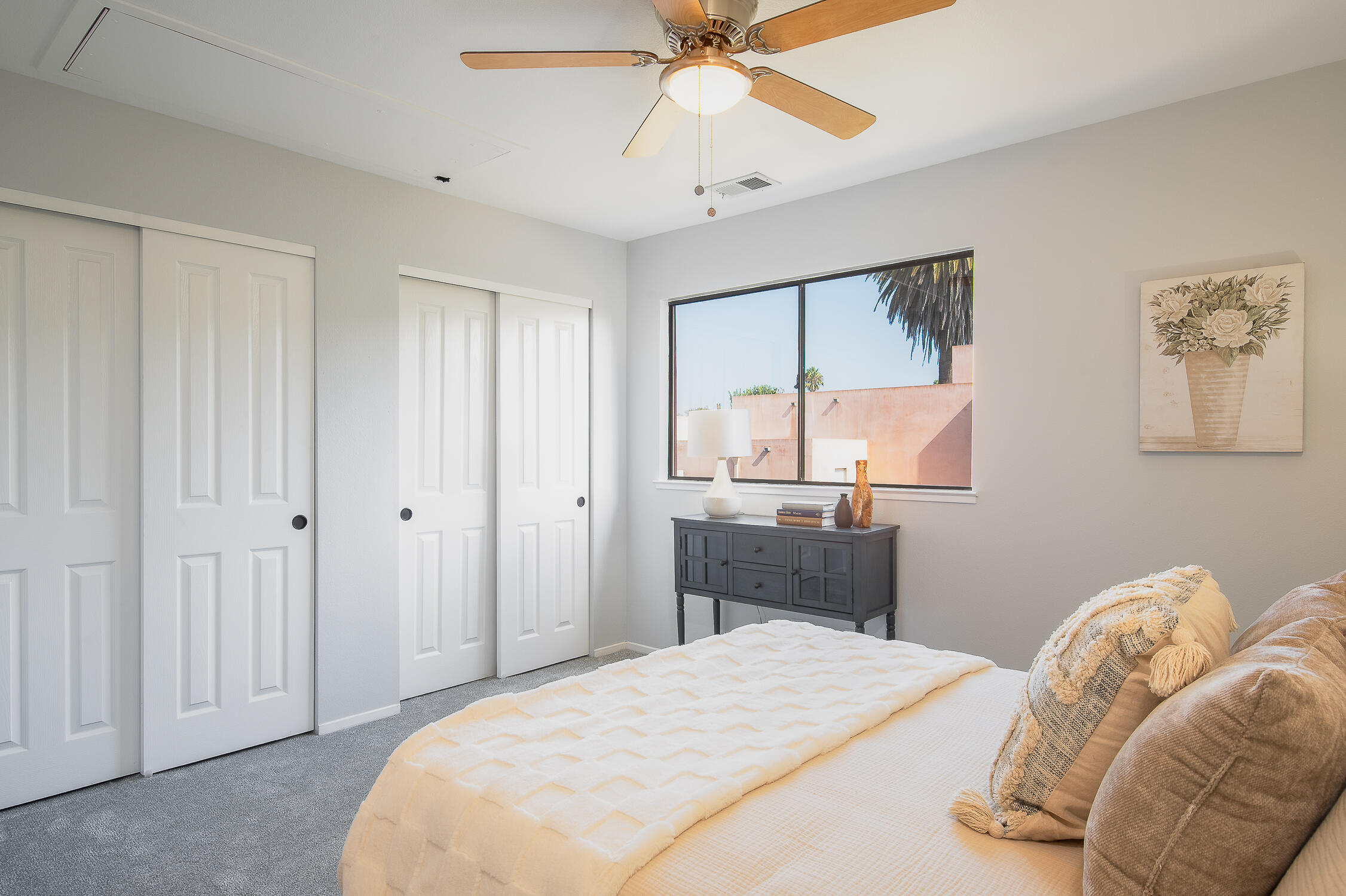 4344 Modoc Road, Unit 2 Santa Barbara, CA 93110 - Photo 18 of 28 a bedroom with a bed and a chandelier