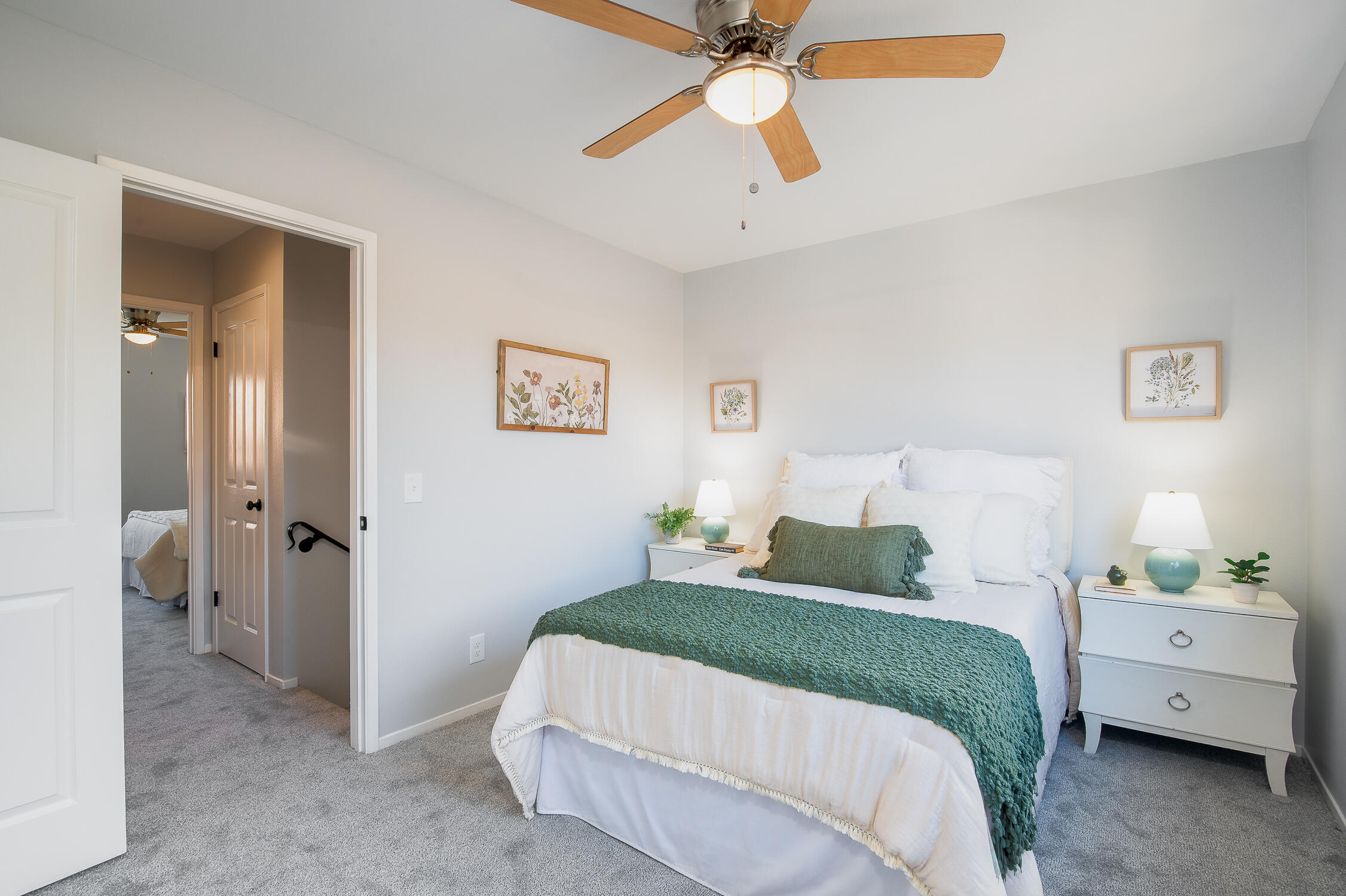 4344 Modoc Road, Unit 2 Santa Barbara, CA 93110 - Photo 22 of 28 a bedroom with a bed and a chandelier
