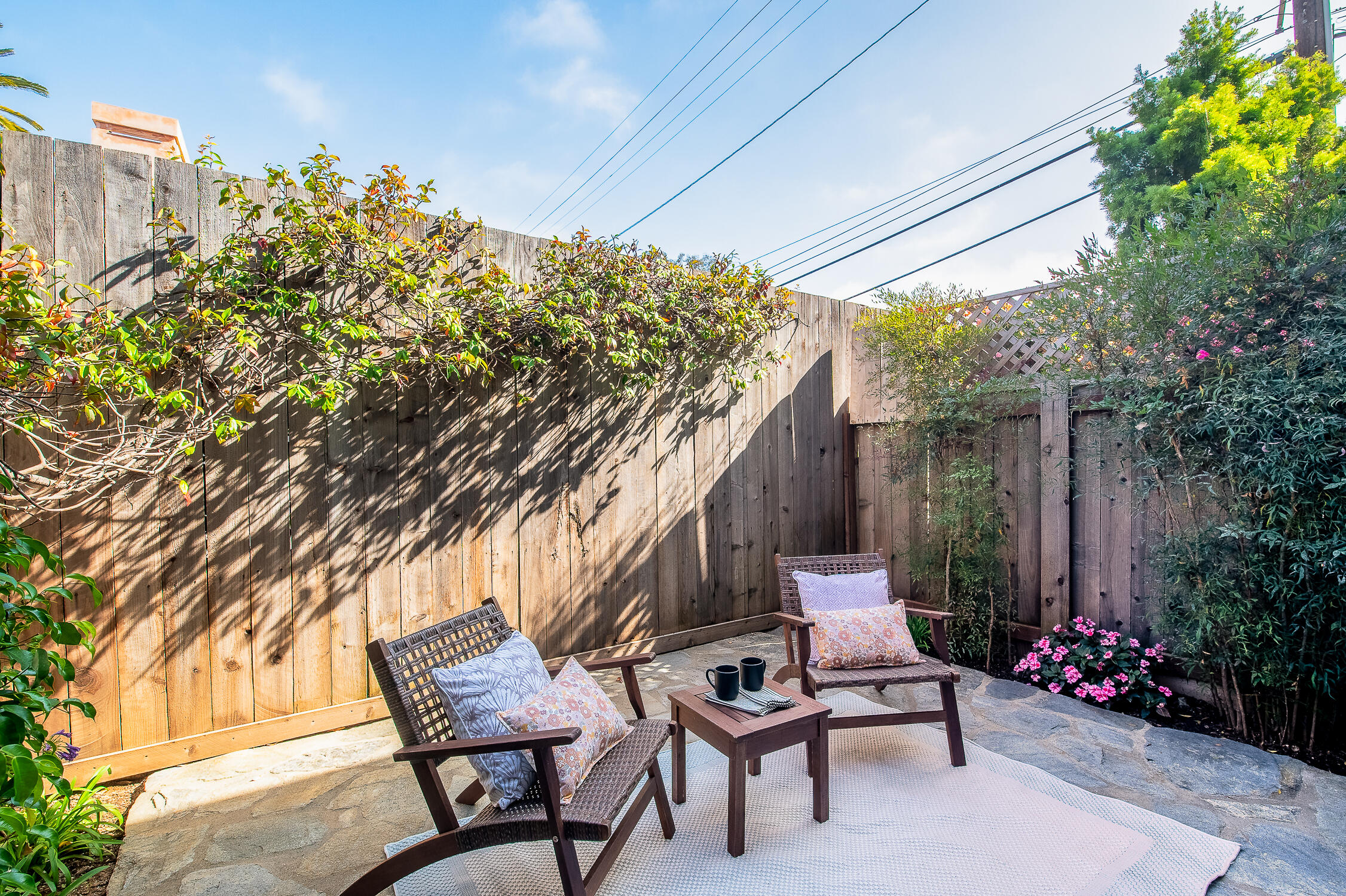 4344 Modoc Road, Unit 2 Santa Barbara, CA 93110 - Photo 24 of 28 a wooden bench sitting in backside of a house