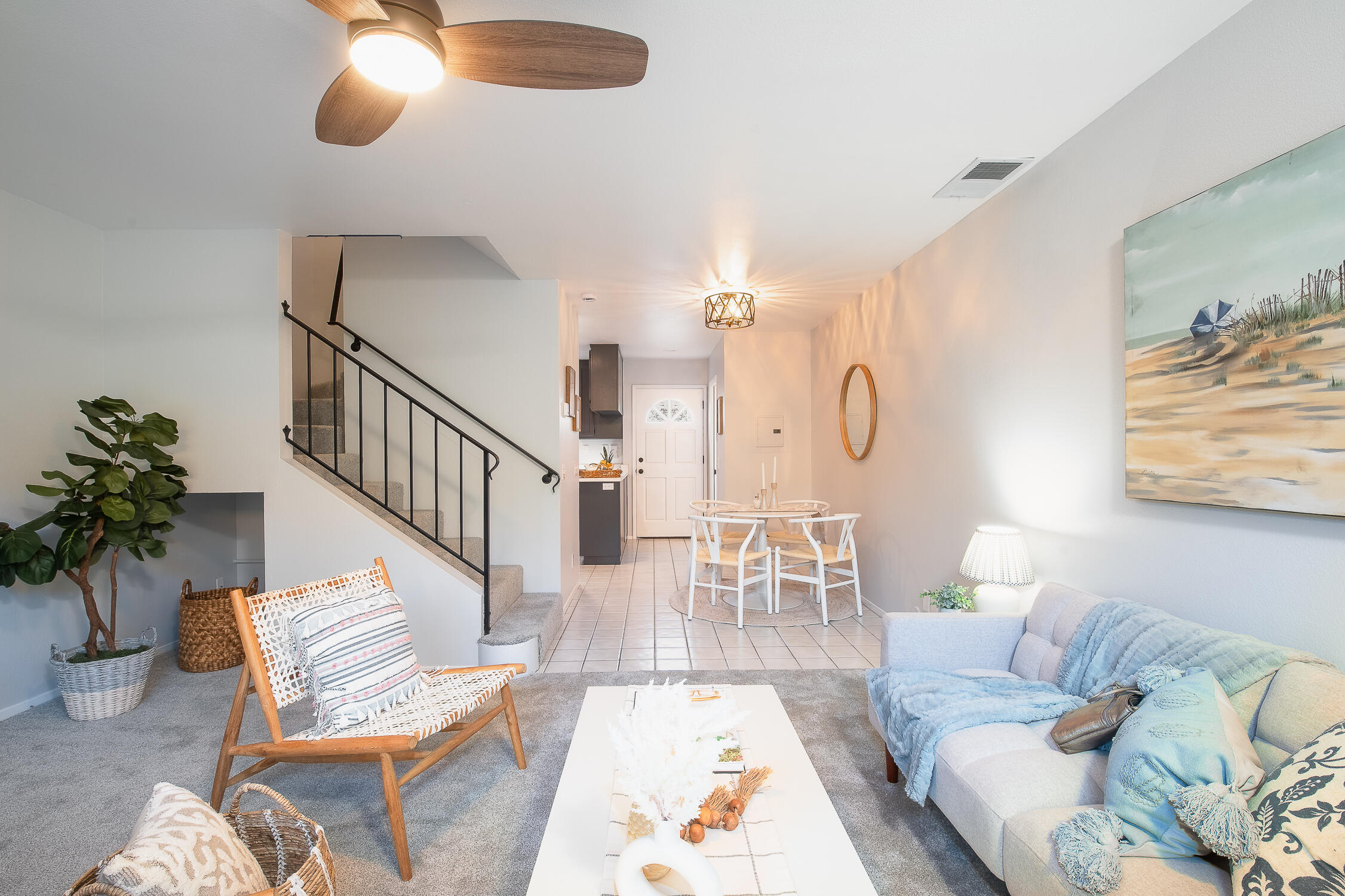 4344 Modoc Road, Unit 2 Santa Barbara, CA 93110 - Photo 8 of 28 a living room with furniture chandelier and a rug