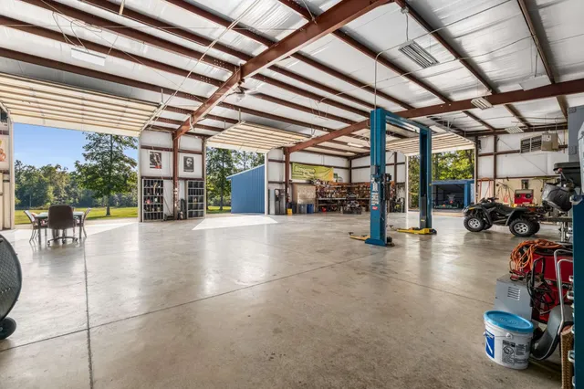 a view of a swimming pool and an outdoor seating