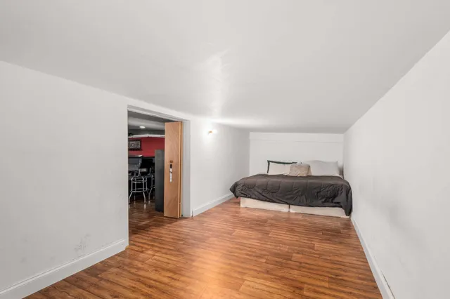 a garage filled with furniture and a bed