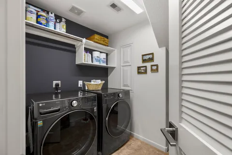 a view of a hallway with workspace and closet