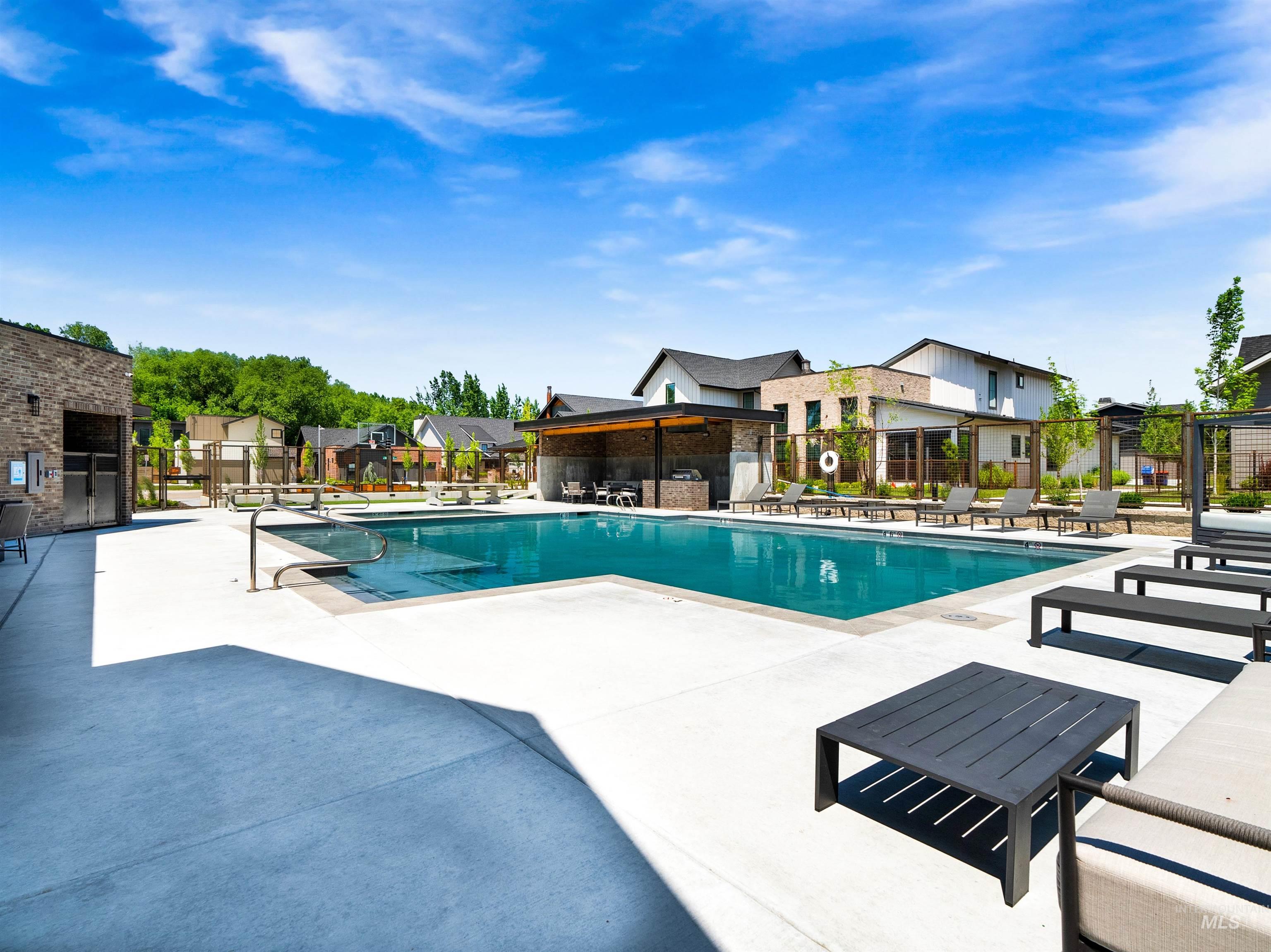 2526 West Rustic Forge Street Eagle, ID 83616 - Photo 11 of 50 Community pool with a patio and a residential view