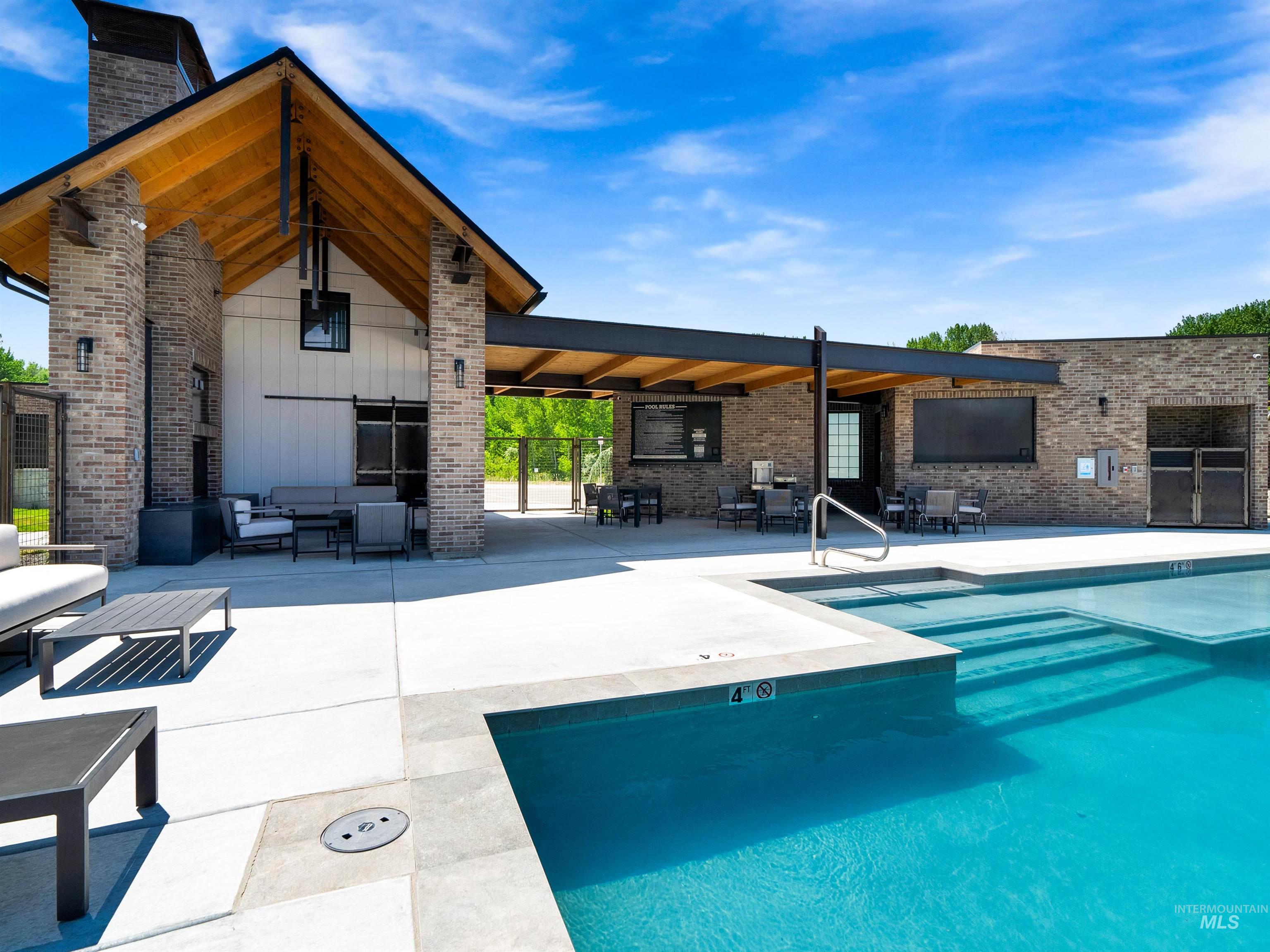 2526 West Rustic Forge Street Eagle, ID 83616 - Photo 15 of 50 Community pool with a patio and an outdoor hangout area