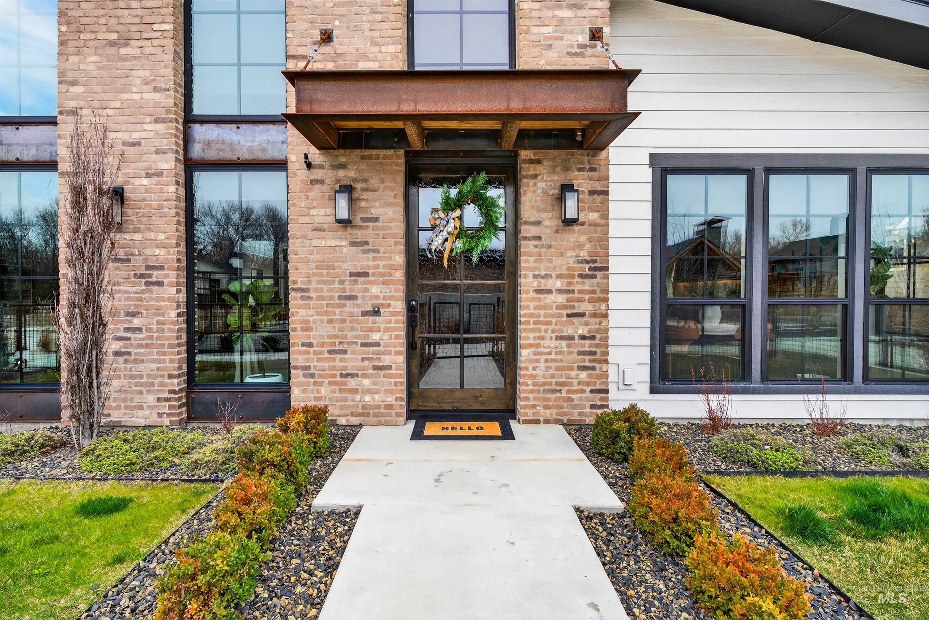2526 West Rustic Forge Street Eagle, ID 83616 - Photo 2 of 50 View of exterior entry with brick siding