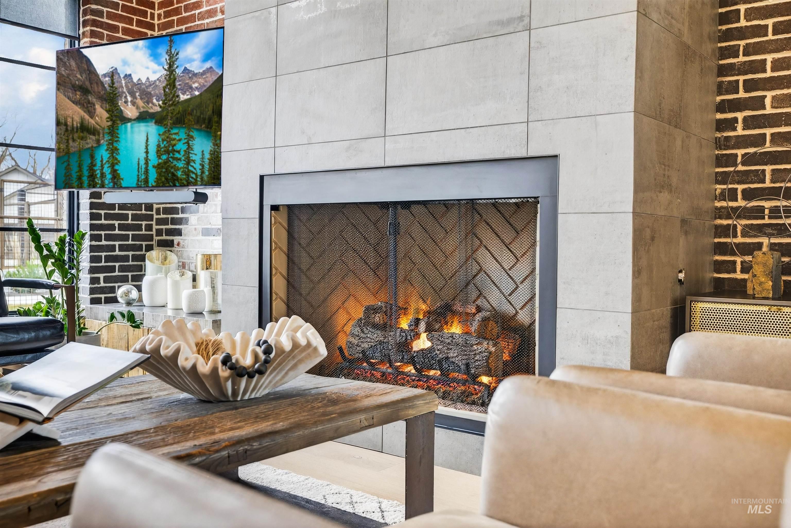 2526 West Rustic Forge Street Eagle, ID 83616 - Photo 21 of 50 Detailed view of a warm lit fireplace