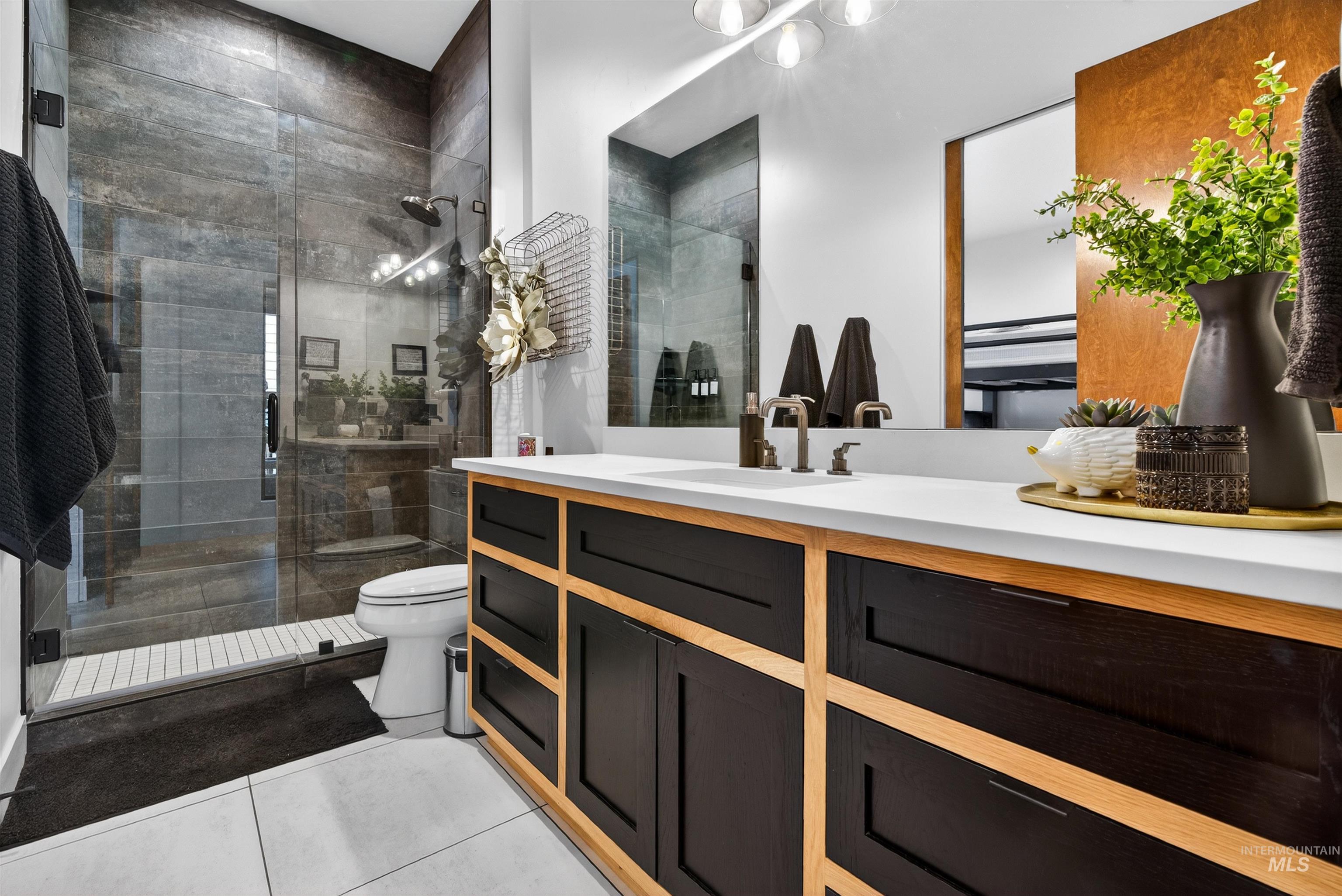 2526 West Rustic Forge Street Eagle, ID 83616 - Photo 40 of 50 Full bath with vanity, a shower stall, and light tile patterned floors
