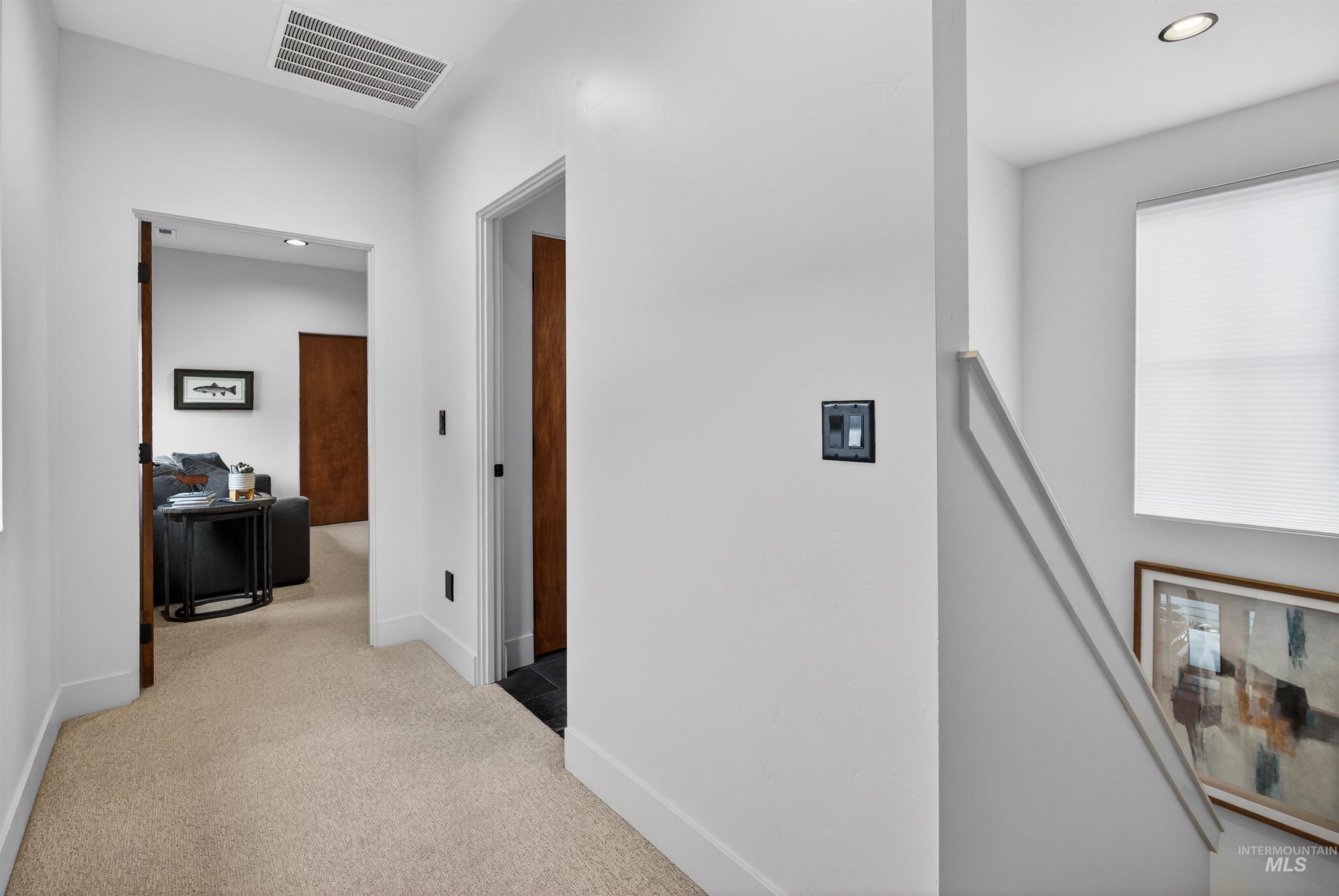 2526 West Rustic Forge Street Eagle, ID 83616 - Photo 41 of 50 Corridor featuring an upstairs landing, recessed lighting, and light colored carpet
