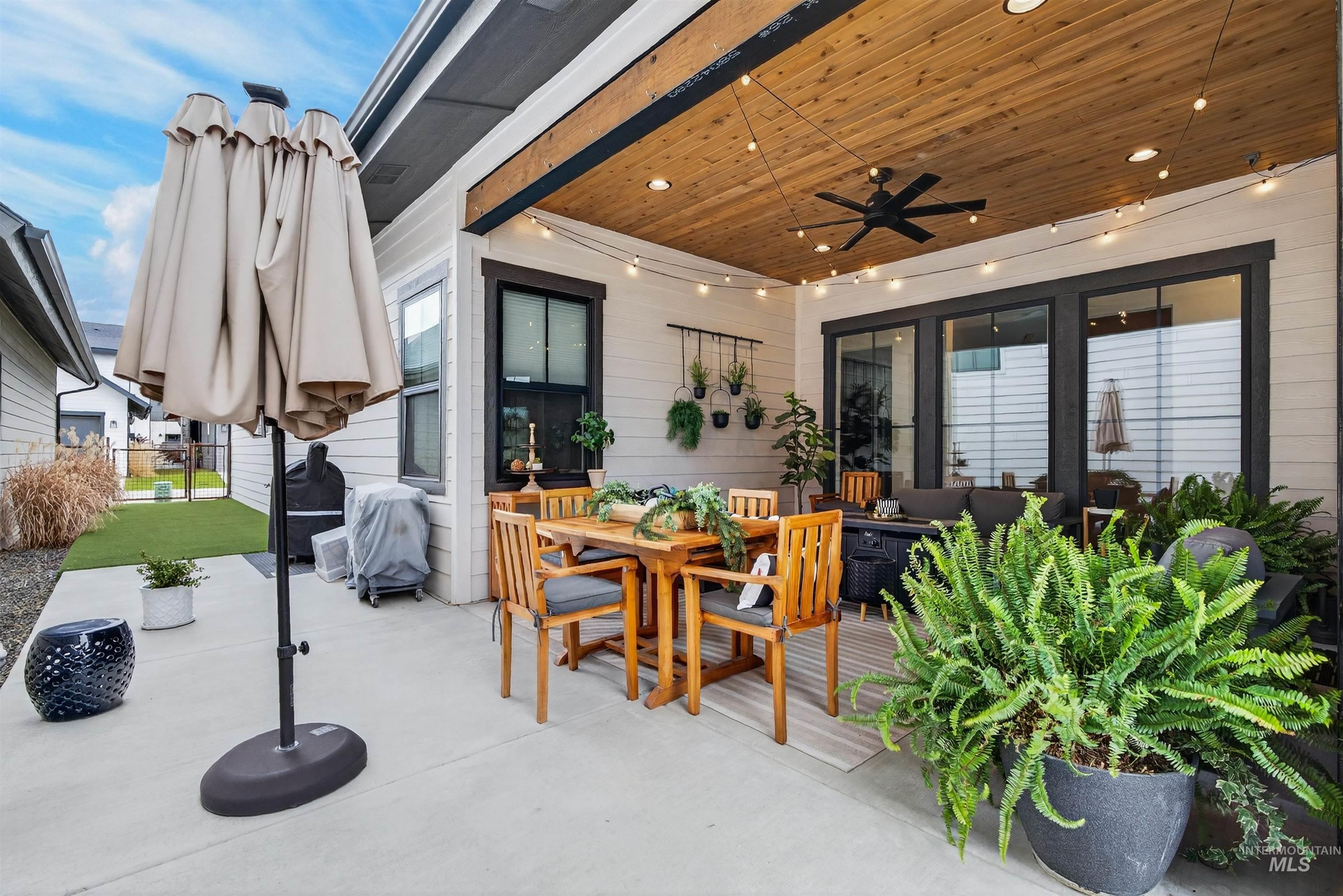 2526 West Rustic Forge Street Eagle, ID 83616 - Photo 49 of 50 View of patio featuring a ceiling fan, an outdoor living / dining area, and grilling area