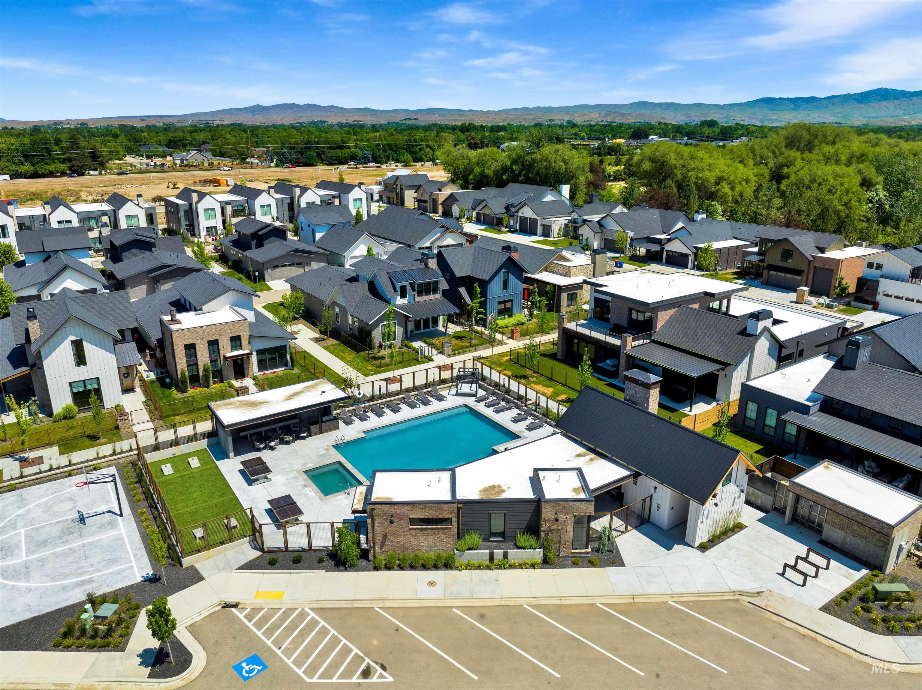 2526 West Rustic Forge Street Eagle, ID 83616 - Photo 8 of 50 Aerial perspective of suburban area with a pool area and a mountainous background