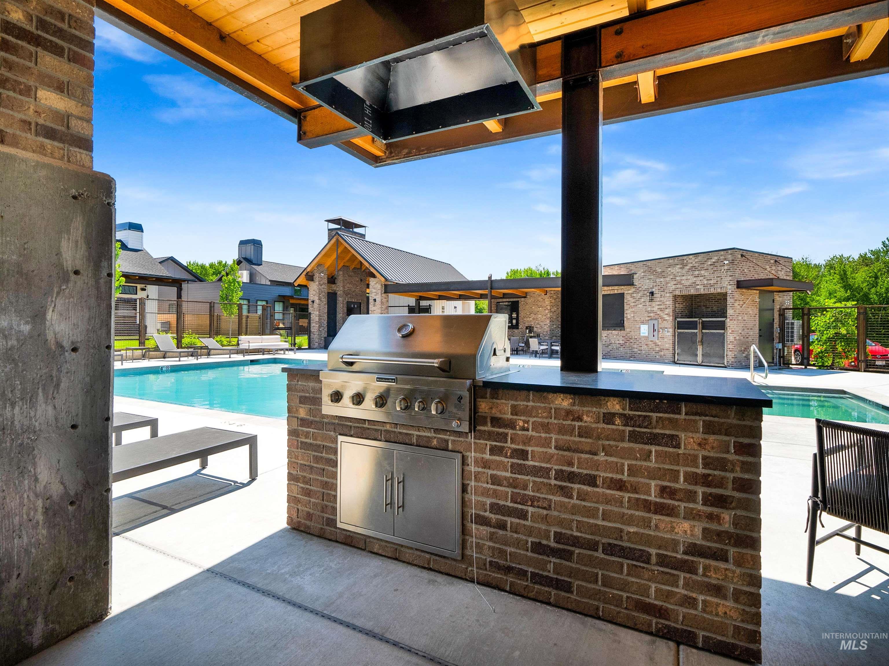 2526 West Rustic Forge Street Eagle, ID 83616 - Photo 10 of 50 View of patio / terrace with a community pool and area for grilling